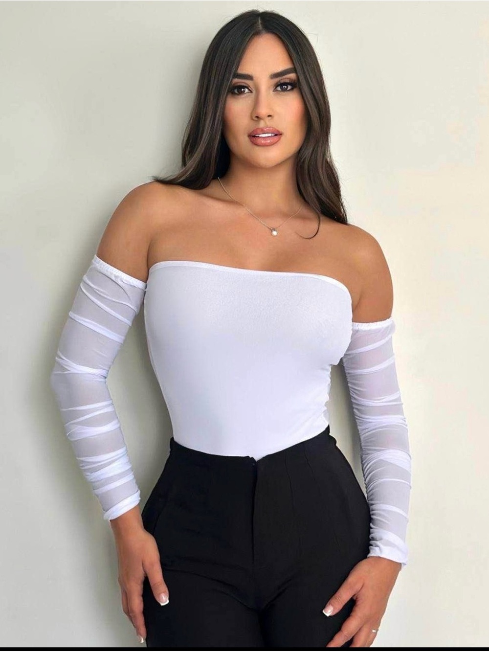 White shaper bodysuit with sleeve and mesh back with bare shoulders